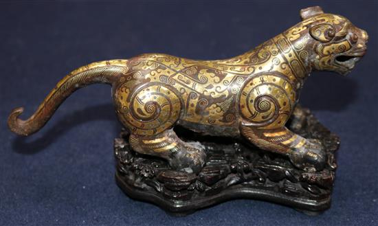 A Chinese parcel gilt bronze figure of a tiger, in Song dynasty style, length 18cm, together with a fitted hardwood box